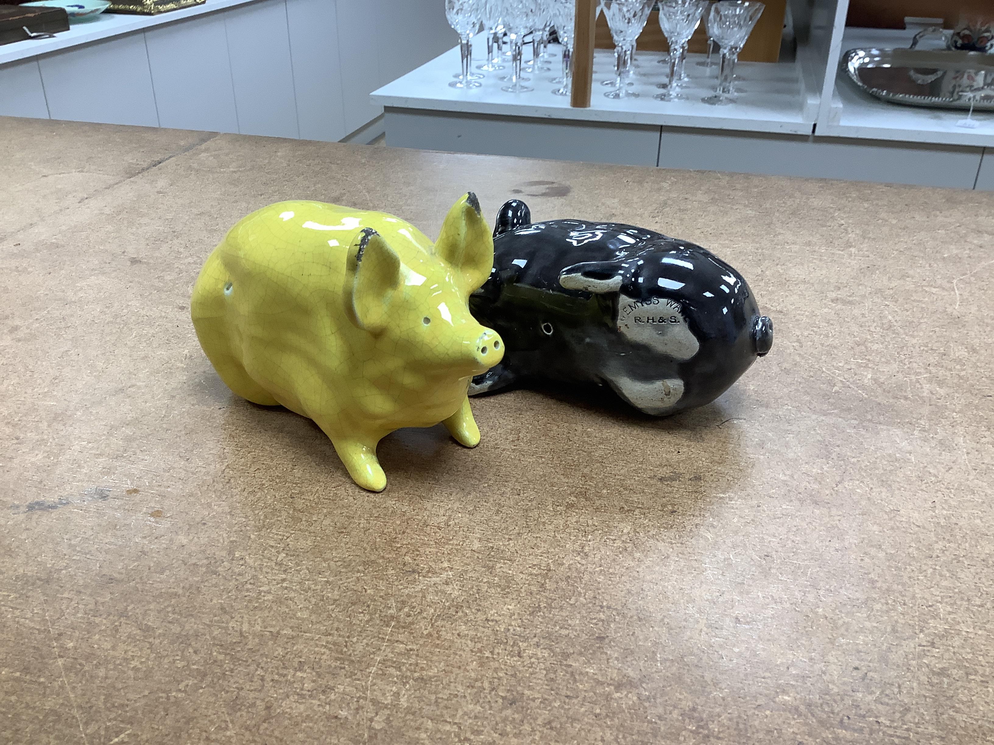 Three Wemyss ware pigs in green, yellow and black glazes, 15cm